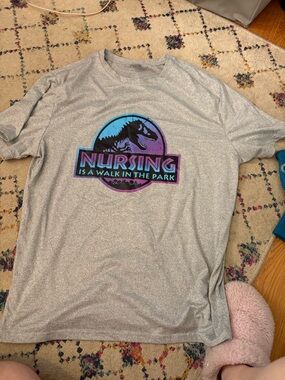 Gray Graphic Tee - "Nursing is a Walk in the Park" Dinosaur Logo